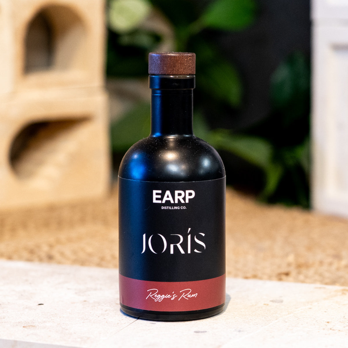A black 200mL bottle labelled with a local brand's identity